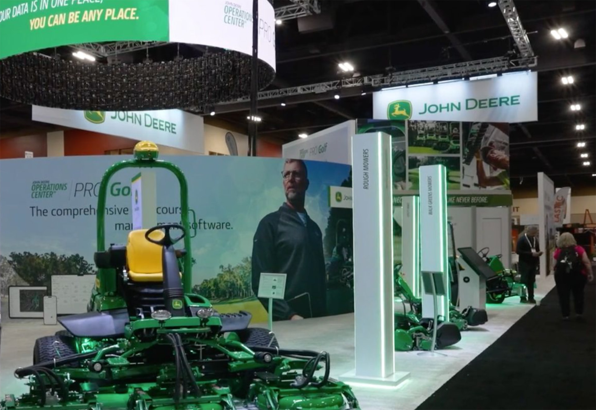 John Deere tradeshow booth with a zero turn mower in the front.