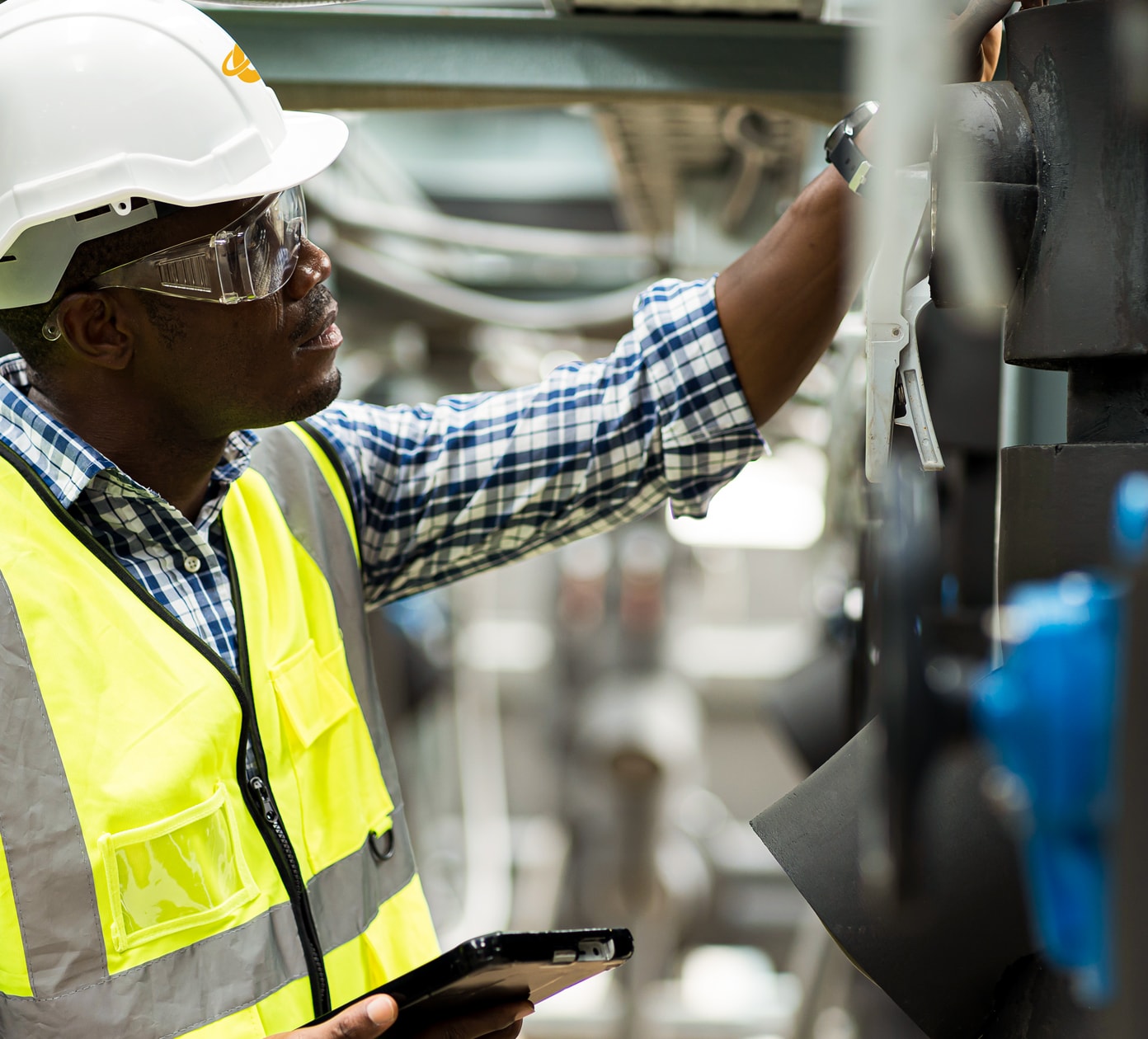 Man in a high visibility vest and hard hat.